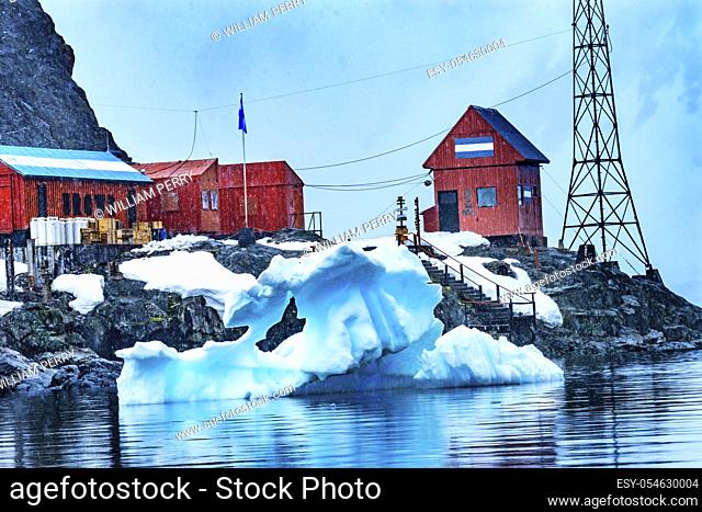 Snowing Argentine Almirante Brown Station Blue Glacier Mountain Paradise Harbor Bay Antarctic Peninsula Antarctica. Glacier ice blue because air squeezed out of...