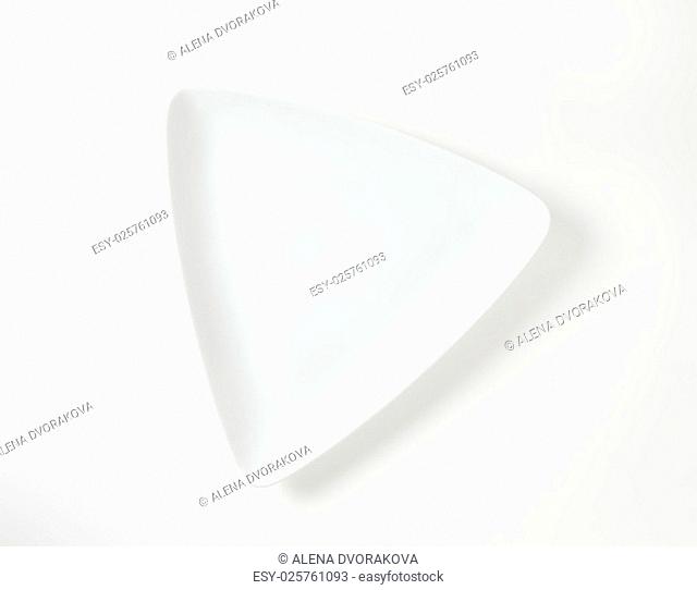 white triangular plate on white background