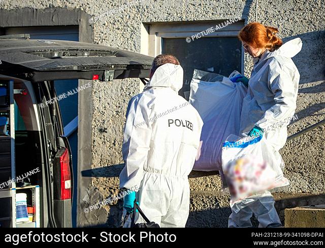 18 December 2023, Baden-Württemberg, Bingen-Hitzkofen: Forensics officers leave a house in Hitzkofen. A two-year-old child has been missing in the municipality...