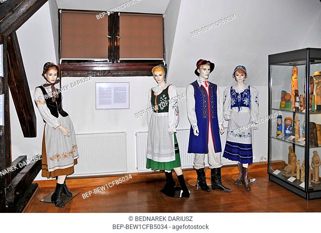 Castle of the Teutonic Order and West Kashubia Museum in town Bytow, Pomeranian Voivodeship, Poland. Traditional Kashubian costumes