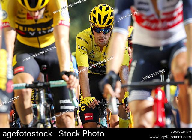 Primoz Roglic of Team Jumbo - Visma wearing the yellow jersey crosses the finish line of the eleventh stage of the 107th edition of the Tour de France cycling...