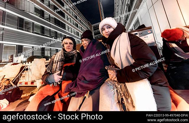 12 March 2022, Hamburg: Three women from Ukraine wait in front of the Hammer Straße registration office. They hold out overnight in order not to lose their...