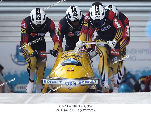 Bobsleigh pilot Francesco Friedrich and his pushers Candy Bauer, Martin Grothkopp and Thorsten Margis (L-R) of Germany in action during the men's race in the...