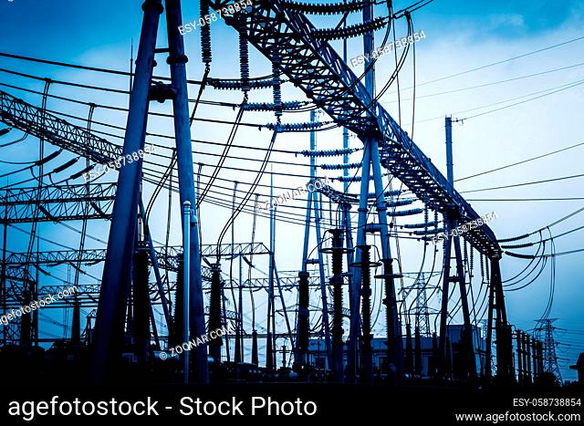 High voltage towers with sky background