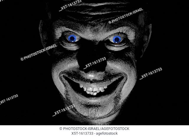 Blue eyed demon with an evil smile