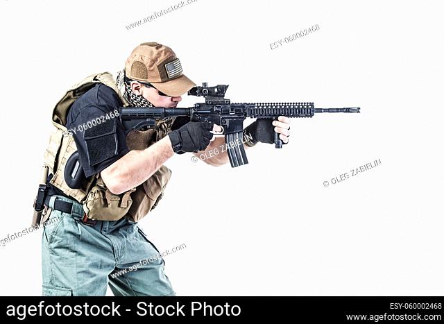Studio shot of private military contractor PMC with assault rifle
