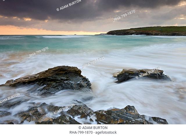 Incoming waves surge onto the shore at Harlyn Bay in North Cornwall, England, United Kingdom, Europe