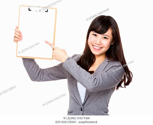 Businesswoman finger point to blank page of clipboard