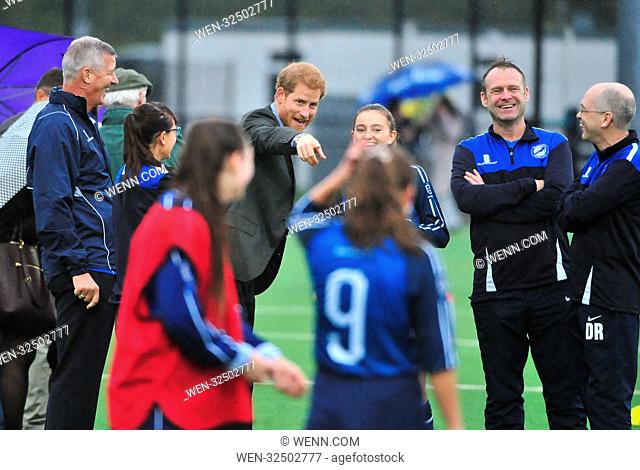 Prince Harry is seen receiving a football shirt from refugees at the UCLAN sports arena, Preston. The Prince also watched people with disabilities and young...