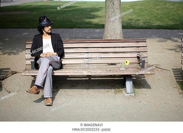 Man Sitting on Bench