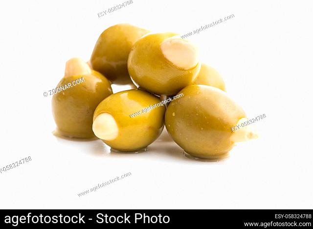Pitted green olives stuffed with almonds isolated on white background