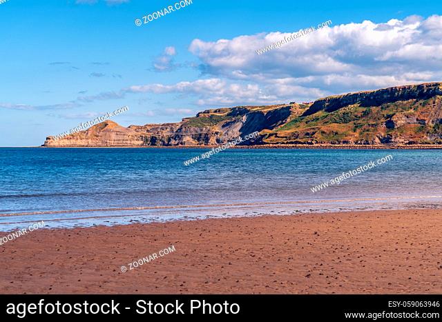 North Sea Coast in North Yorkshire, England, UK - looking from Runswick Bay towards the former quarry in Kettleness Point