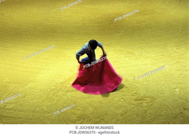 In a arena of the Bohorquez finca a torero is preparing for a tentadero