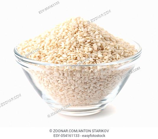 Glass bowl of sesame seeds isolated on white