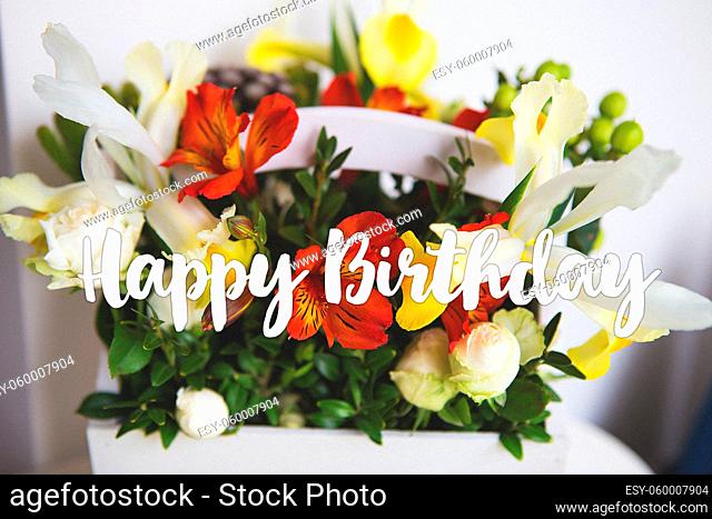 Very beautiful wooden white basket with different colors. Inscription Happy Birthday. Filter. Close-up
