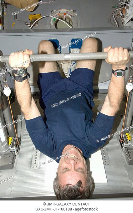 Canadian Space Agency astronaut Robert Thirsk, Expedition 20 flight engineer, exercises using the Interim Resistive Exercise Device (IRED) equipment in the...