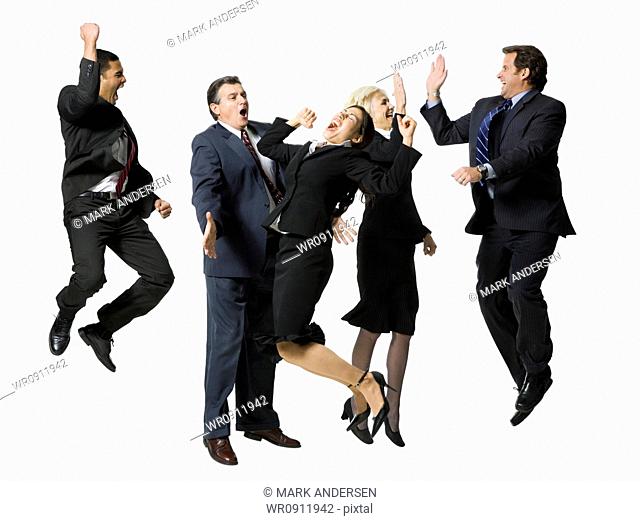 Five businesspeople leaping and smiling