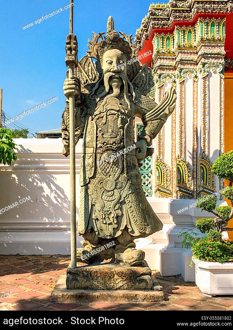 Large Chinese statues in the Wat Pho, guarding the gates of the perimeter walls as well as other gates within the compound in the famous temple in Bangkok