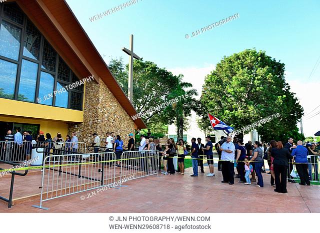 Miami Marlins fans pay their respects to Miami Marlins pitcher Jose Fernandez (#16) during the public viewing at St. Brendan Catholic Church in Miami, Florida
