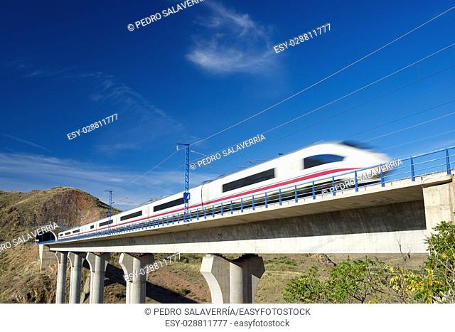 view of a high-speed train crossing a viaduct in Purroy, Zaragoza, Aragon, Spain. AVE Madrid Barcelona