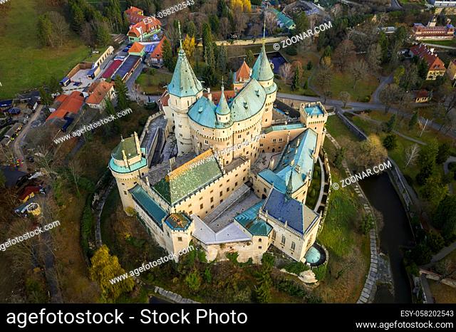 Aerial view of famous castle in Bojnice, Slovakia, from aerial view with road approach and small part of surrounding town