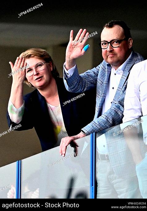 Belga freelance photographer Yorick Jansens (C) and his wife Isolde Schoofs (L) pictured during a soccer match between KRC Genk and Club Brugge