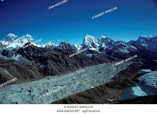 Mt. Everest (l), Ngozumpa glacier & tiny Village of Gokyo, Himalayas, Nepal