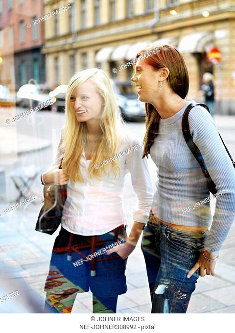 Two teenage girls shopping