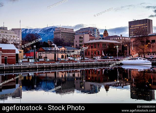 Hobart, Tasmania, Australia on July 9, 2013: Waterfront in wintertime with Mt. Wellington covered in snow