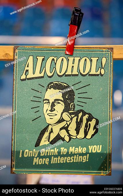 Arnhem, Netherlands, January2020: Old vintage Advertise sign with text Alcohol I Only Drink to Make YOU More Interesting