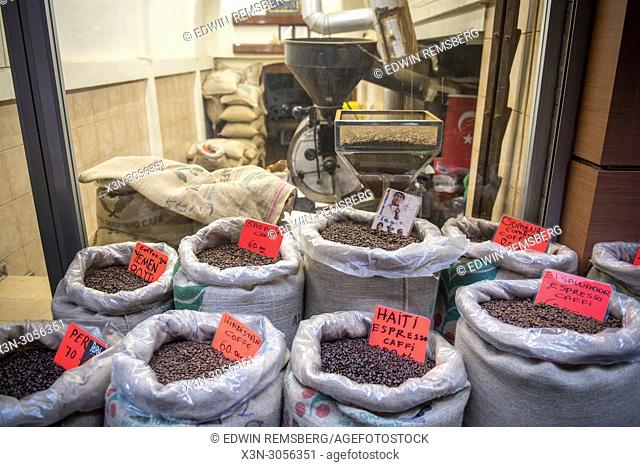 In front of a shop are linen bags filled to the brim with a variety of different blends of roasted coffee beans, Istanbul, Turkey