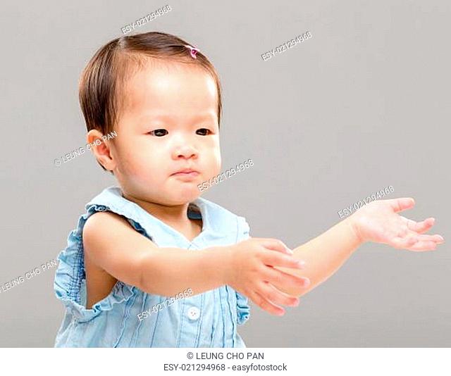 Little girl pulling hand up