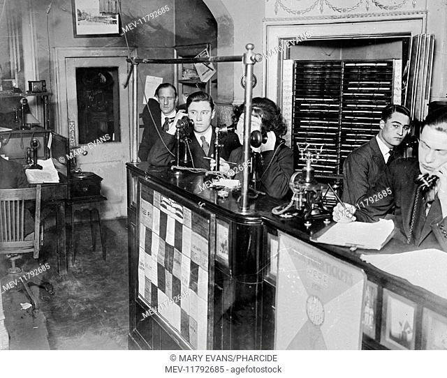 Society of Entertainers, with Webster & Girling Ltd theatre ticket box office, Upper Baker Street, London -- interior view, with staff at work on telephones