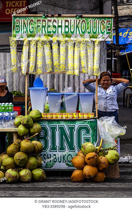 A Filipino Woman Sells Buko Juice From A Stall During The Dinagyang Festival, Iloilo City, Panay Island, The Philippines