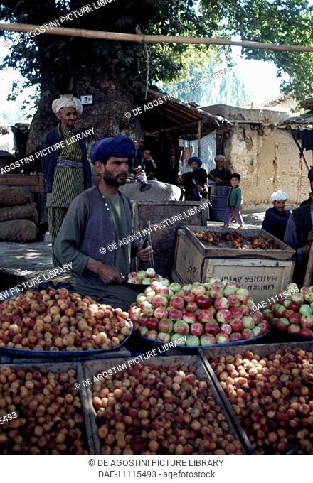 Apple seller at the market in Feyzabad, Afghanistan