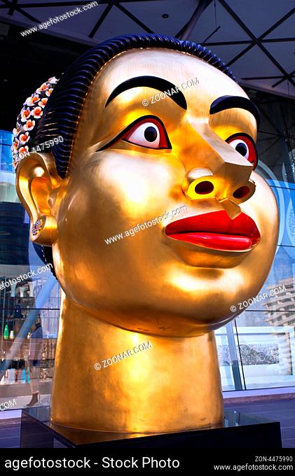 BANGKOK - NOVEMBER 25:Sculpture of Indian woman's head, dedicated to the 80th Birthday of His Majesty King Bhumibol Adulyadej on 25 November 2009 from...