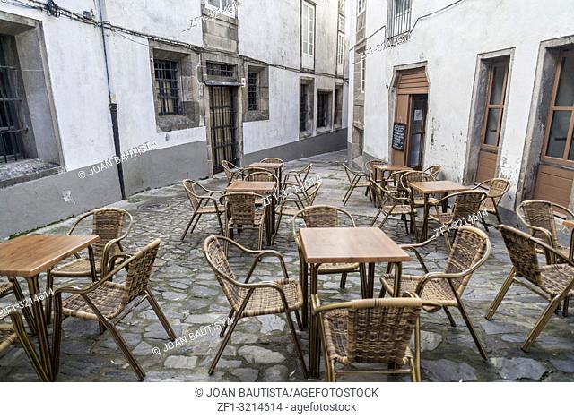 Street view with terrace bar in historic center of Santiago de Compostela, Galicia, Spain