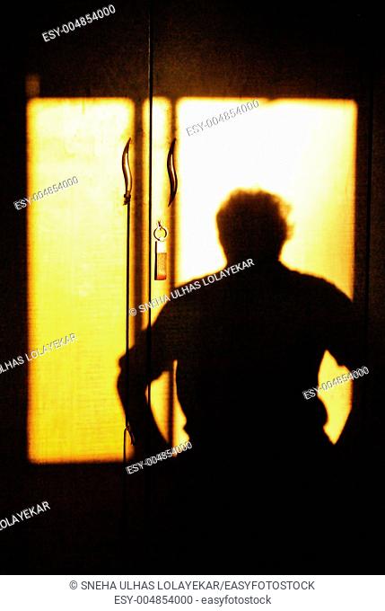Human shadow on cupboard, poona, Maharashtra, India