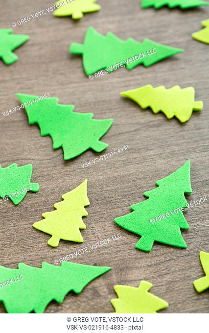 Green tree decorations on table