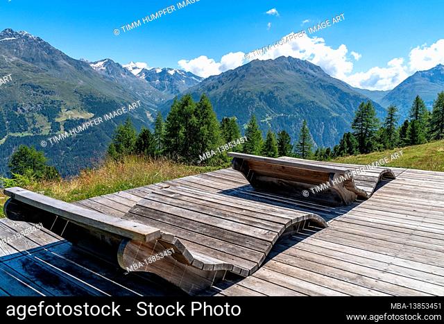 Europe, Austria, Tyrol, Ötztal Alps, Ötztal, Sölden, Cozy wooden loungers with a view of the Brunnenkogel and into the Windachtal