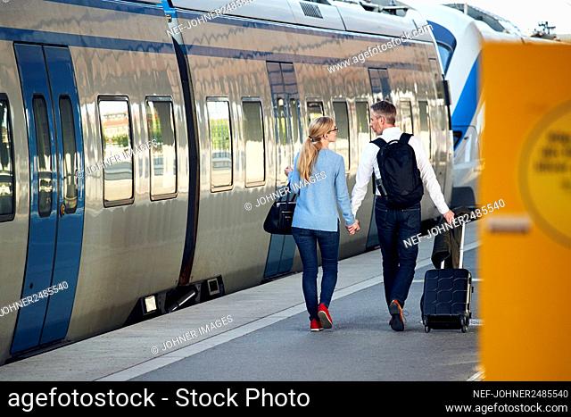 Couple at train station platform