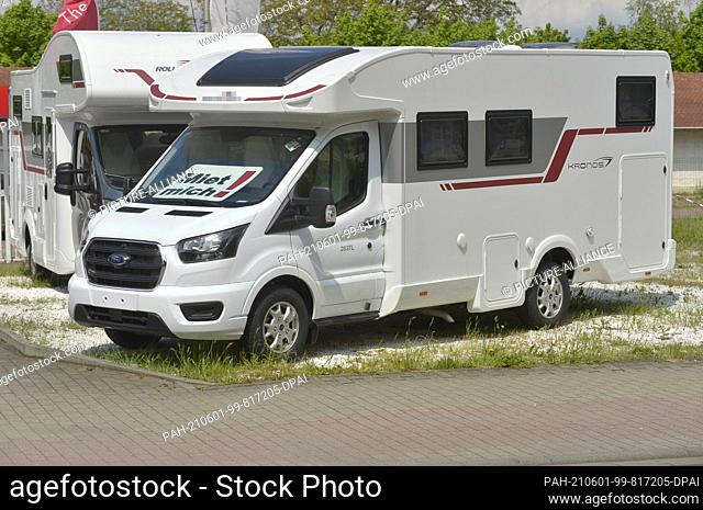 20 May 2021, Saxony, Leipzig: ""Rent me!"" prompts a sign in a motorhome in front of a motorhome rental in Leipzig. Demand for both rental motorhomes and...