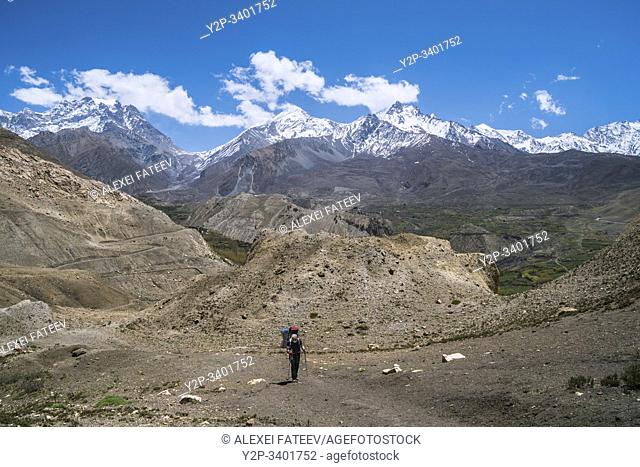 Trekkers on the way from Muktinath to Kagbeni in Mustang district, Nepal