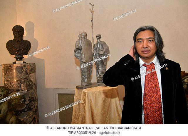 Chinese artist Wu Weishan near the donated artwork ' La barca di qui bai shi e Leonardo' to Accademia delle Belle Arti del Disegno in Florence, ITALY-02-05-2019