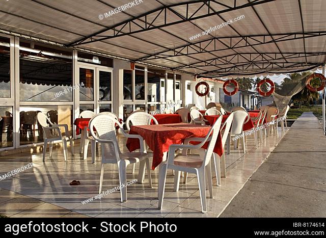 Terrace in front of restaurant with plastic chairs, hotel, bungalow complex, Maria la Gorda, Pinar del Rio province, Cuba, Caribbean, Central America