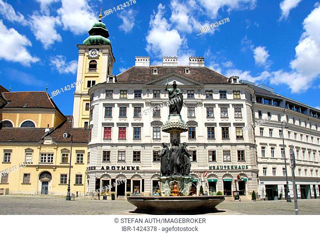 Austriabrunnen fountain, Austria statue with shield and spear, Schubladkastenhaus building, steeple, Schottenstift Benedictine monastery, Am Hof square