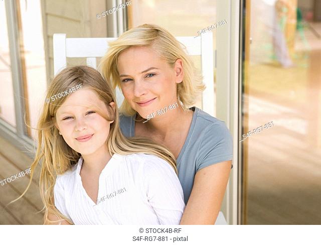 Mother and daughter on terrace, Augsburg, Bavaria, Germany
