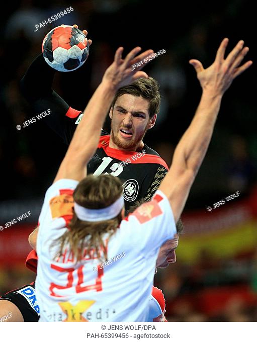 Germany's Hendrik Pekeler in action against Denmark's Mikkel Hansen during the 2016 Men's European Championship handball group 2 match between Germany and...