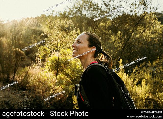 Smiling woman exploring Sierra De Hornachuelos, Cordoba, Spain