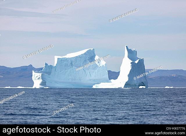 Majestic iceberg on sunny blue Atlantic Ocean Greenland